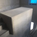 Bijgewerkte centrale koker trappenhal - esthetische betonherstelling